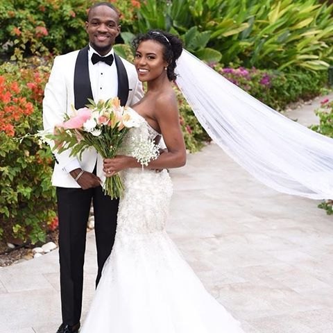 Janai Norman in wedding dress with her husband