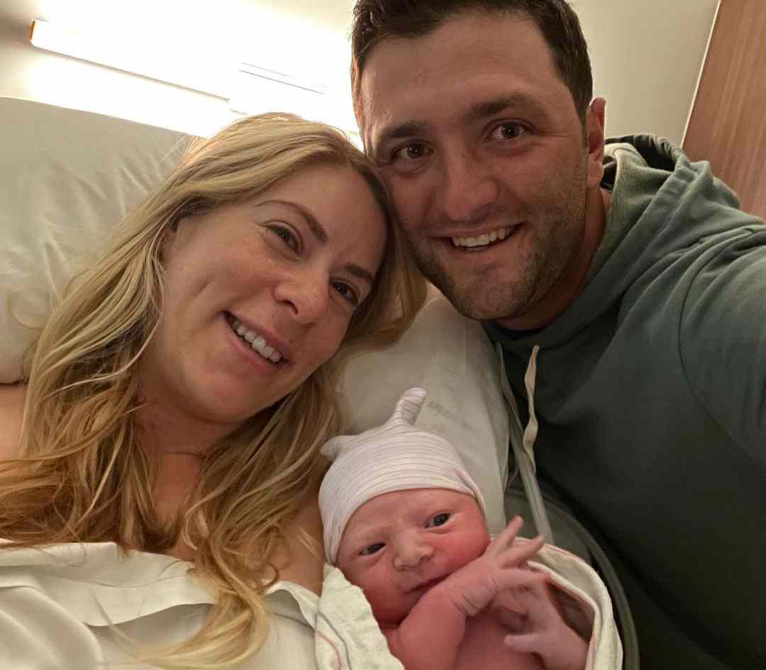 Jon Rahm and his wife, Kelley with their baby